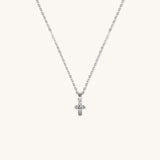 Brooklyn Cross Necklace in sterling silver with cubic zirconia and small heart center, displayed on neutral background for product clarity.