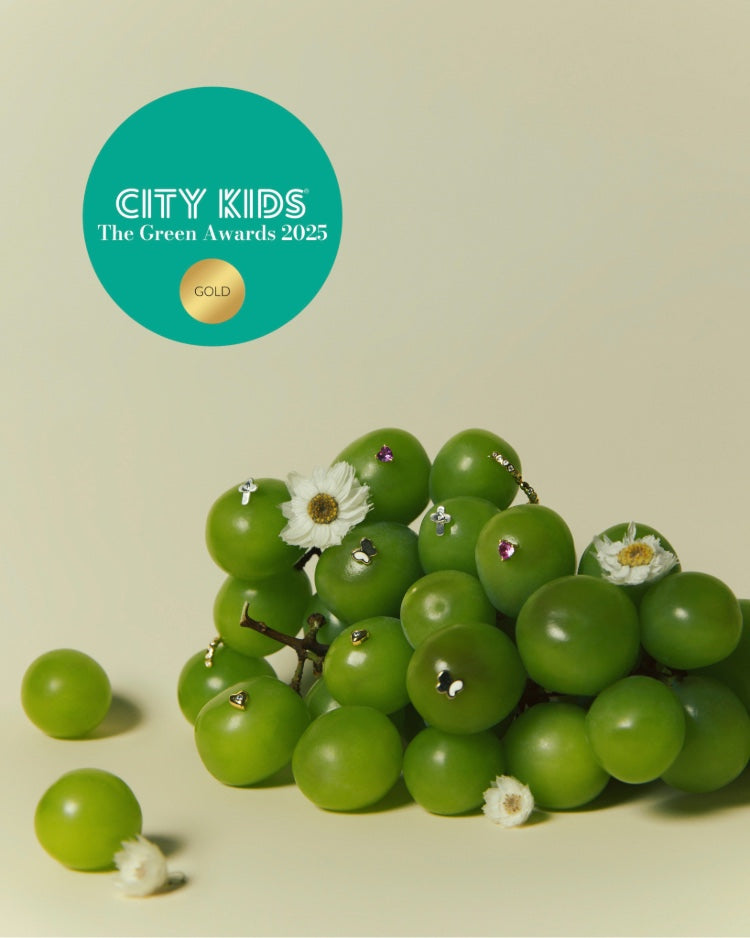 A picture of Blue Francis Earrings in Green Grapes with City Kids The Green Awards 2025 medal in Gold