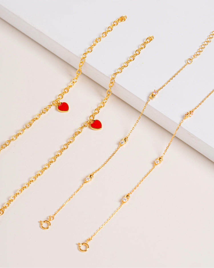 two vermeil Bracelet in flat lay against cream background