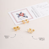 Blue Francis Butter Hudson Butterfly Studs in solid 14K gold with pale yellow enamel, shown alongside pink and white pairs.