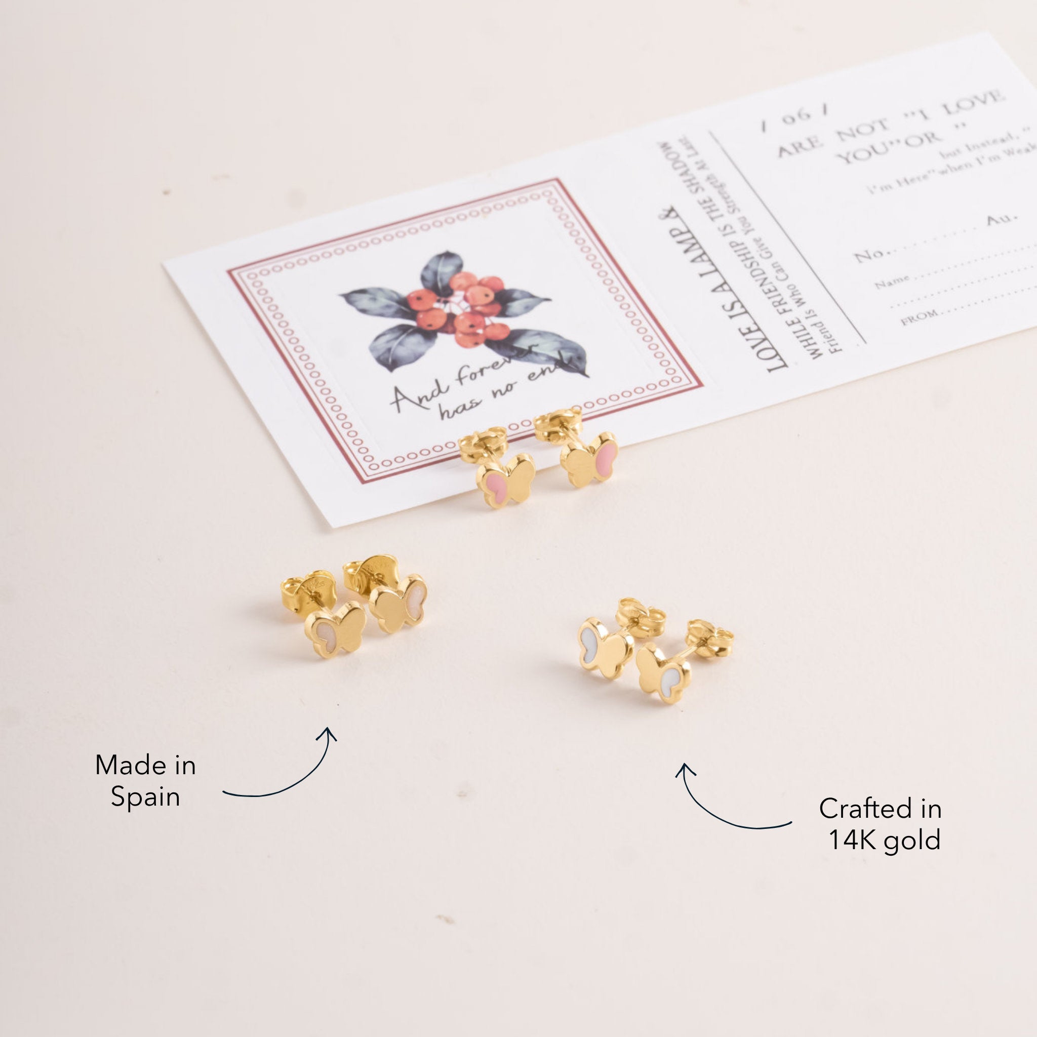 Blue Francis Butter Hudson Butterfly Studs in solid 14K gold with pale yellow enamel, shown alongside pink and white pairs.