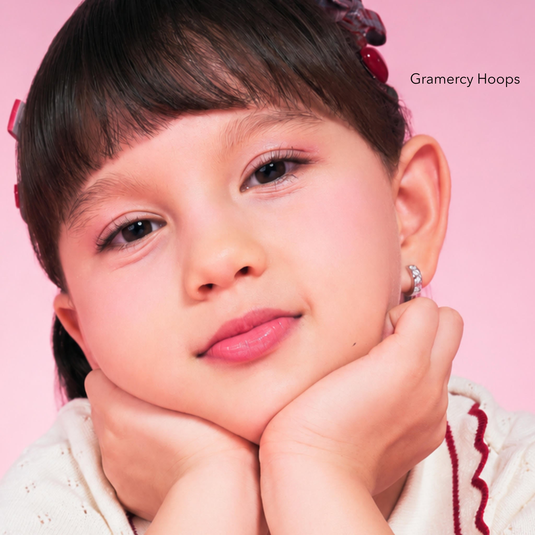 Girl wearing Gramercy Hoops, sterling silver kids hoop earrings with cubic zirconia