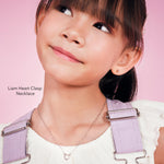 Girl wearing the Liam Heart Clasp Necklace, a sterling silver heart necklace for girls
