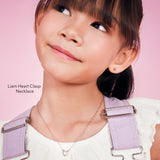 Girl wearing the Liam Heart Clasp Necklace, a sterling silver heart necklace for girls
