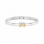 Blue Francis Melodie Butter Fleur Bangle, a sterling silver hinged bangle with butter yellow enamel daisies