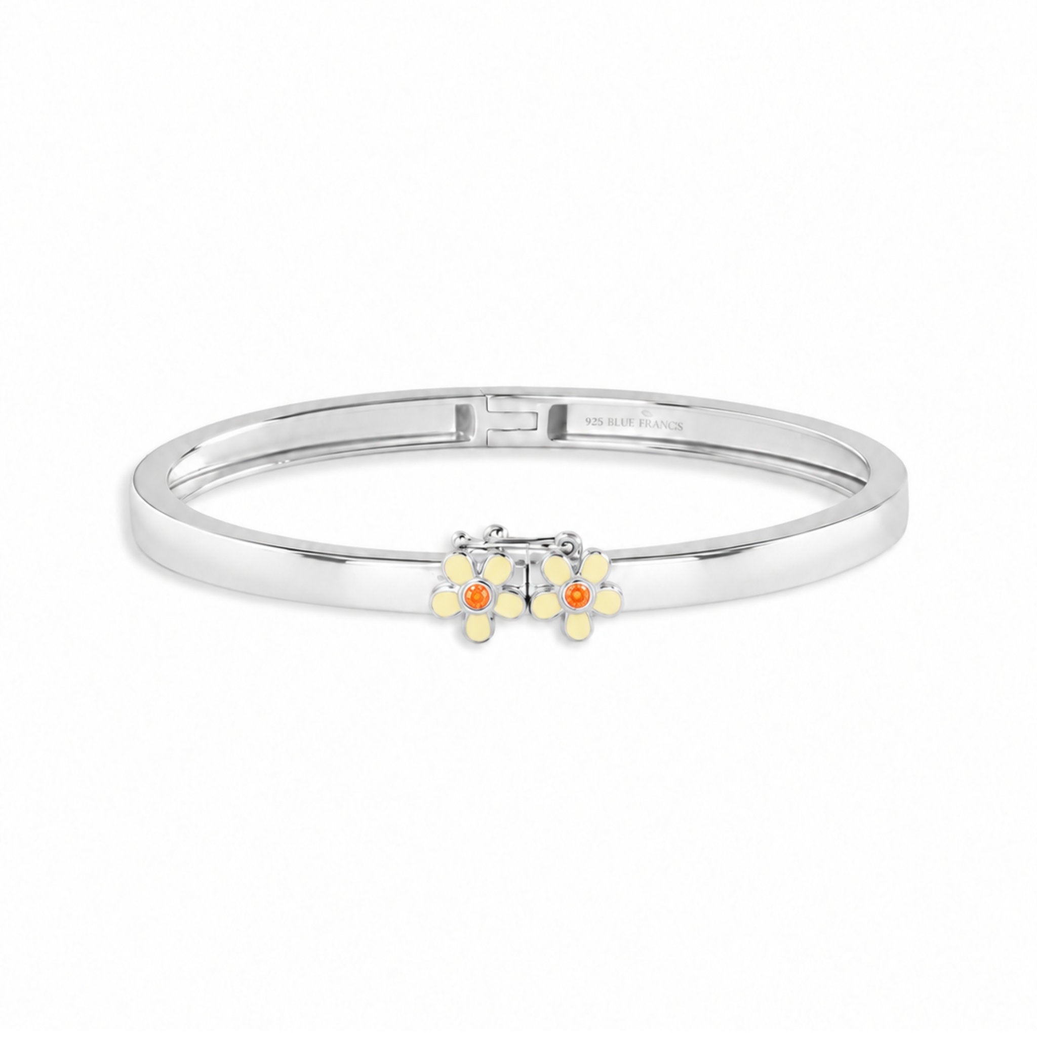 Blue Francis Melodie Butter Fleur Bangle, a sterling silver hinged bangle with butter yellow enamel daisies