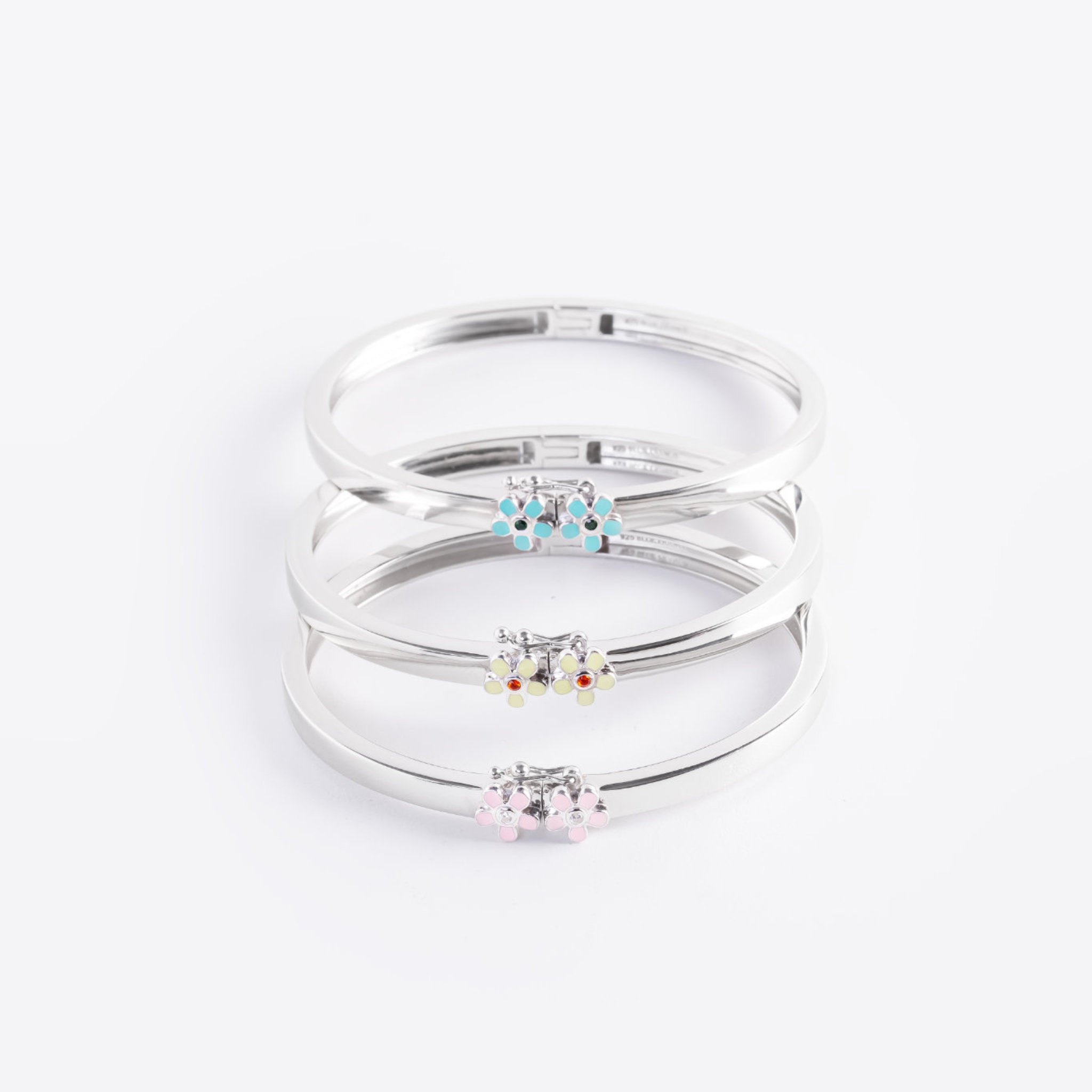 Blue Francis Melodie Fleur Bangles stacked in turquoise, yellow and pink, solid sterling silver flower bracelets
