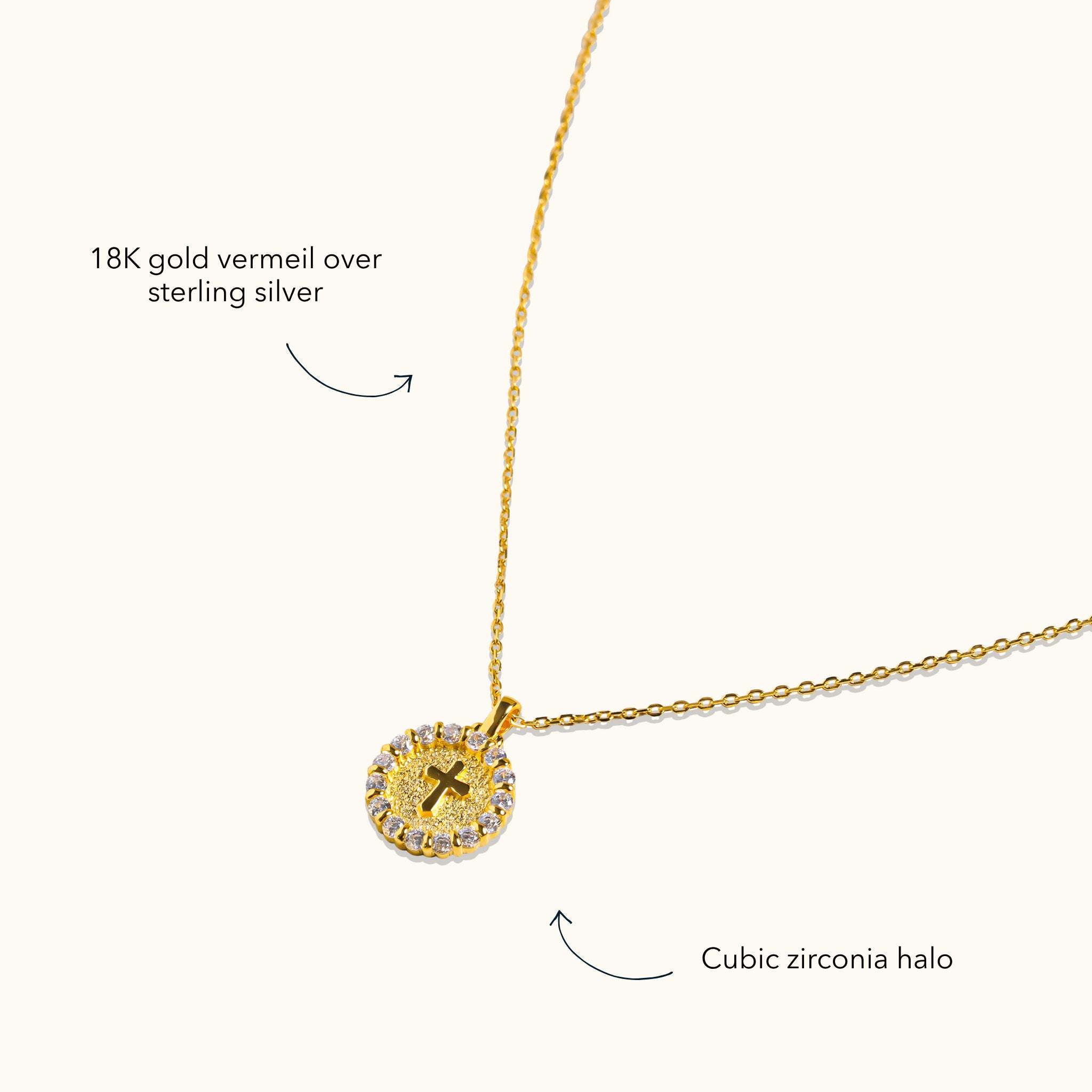 Blue Francis Cross Twinkle Necklace in 18K gold vermeil over sterling silver, with a round cross pendant and cubic zirconia halo.