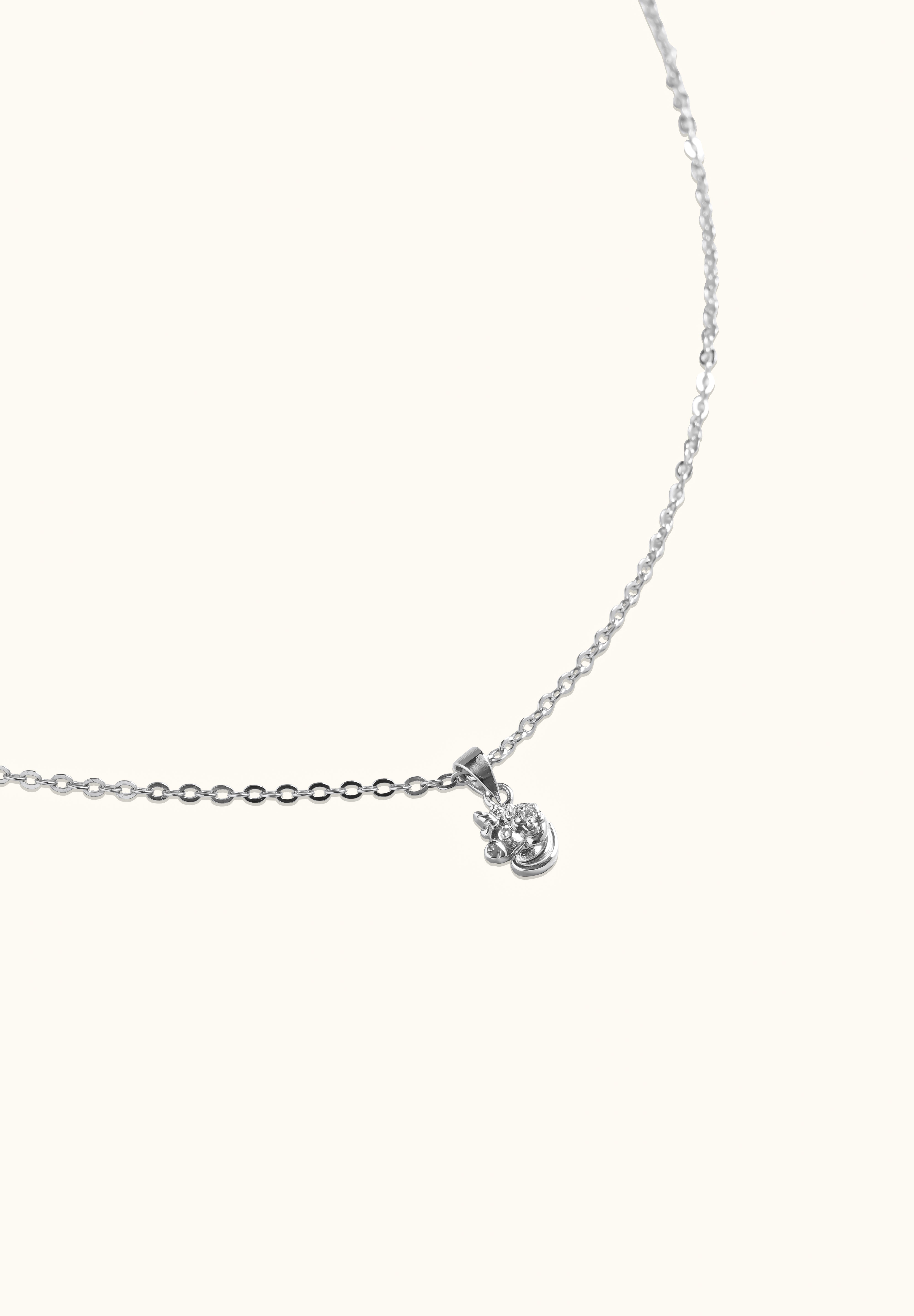 Brooklyn Unicorn Necklace made in Sterling Silver flat lay cream background - Blue Francis