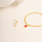Flat lay picture against cream background for Twinkle Heart Studs and Twinkle Bracelet made out of Vermeil - Blue Francis