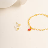 Flat lay picture against cream background for Twinkle Heart Studs and Twinkle Bracelet made out of Vermeil - Blue Francis