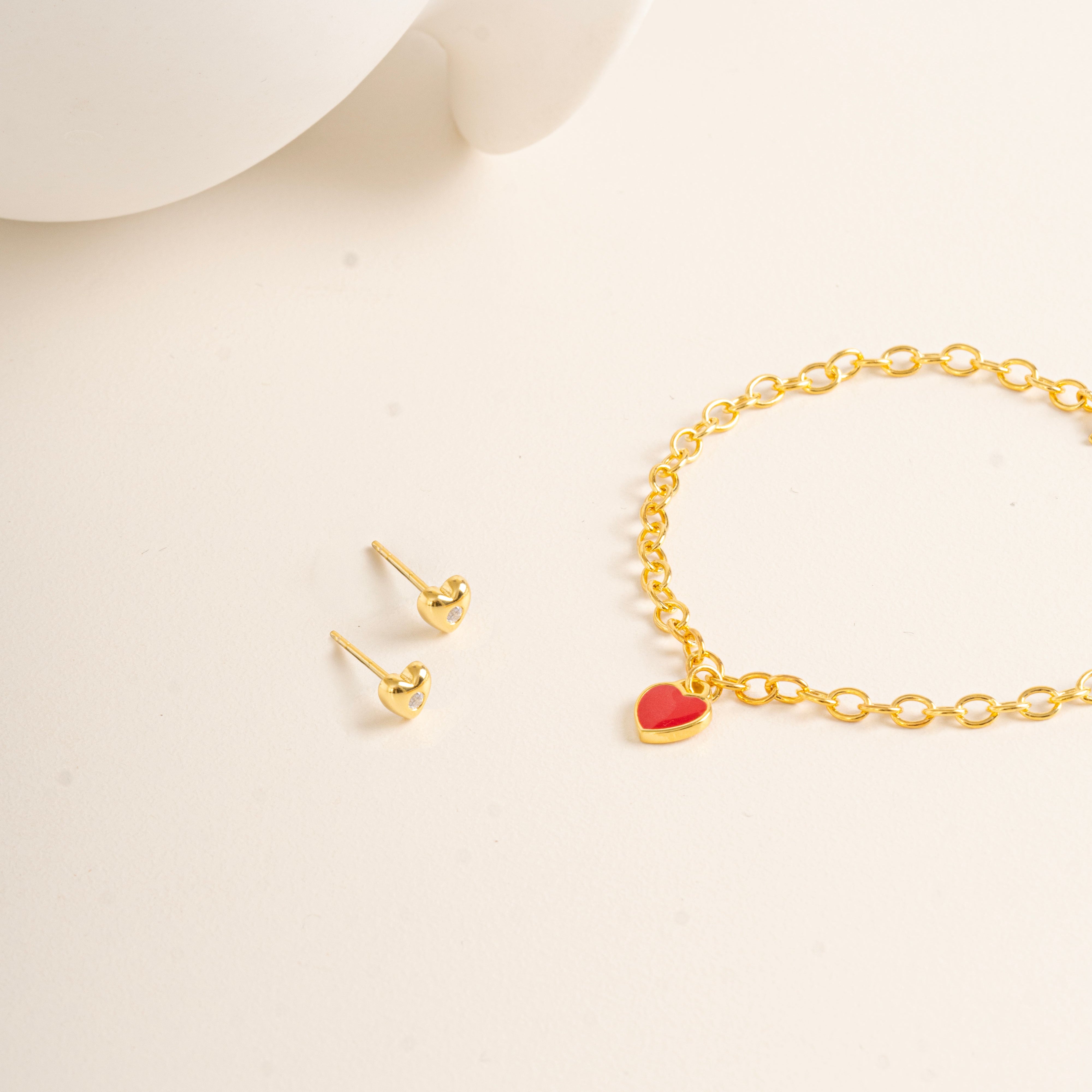 Flat lay picture against cream background for Twinkle Heart Studs and Twinkle Bracelet made out of Vermeil - Blue Francis