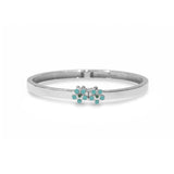 Blue Francis Sterling Silver bangle bracelet with turquoise flower-shaped charms on a white background