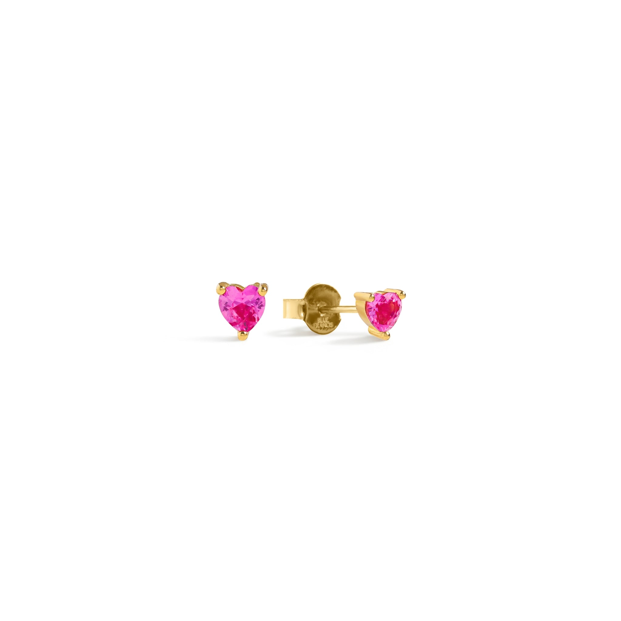 Blue Francis - Ruby Liberty Studs - Heart-shaped pink ruby synthetic gemstone earrings with gold vermeil settings on a white background