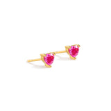 Blue Francis - Ruby Liberty Studs is a Gold heart-shaped earrings with pink gemstones. The earrings is appear on a white background