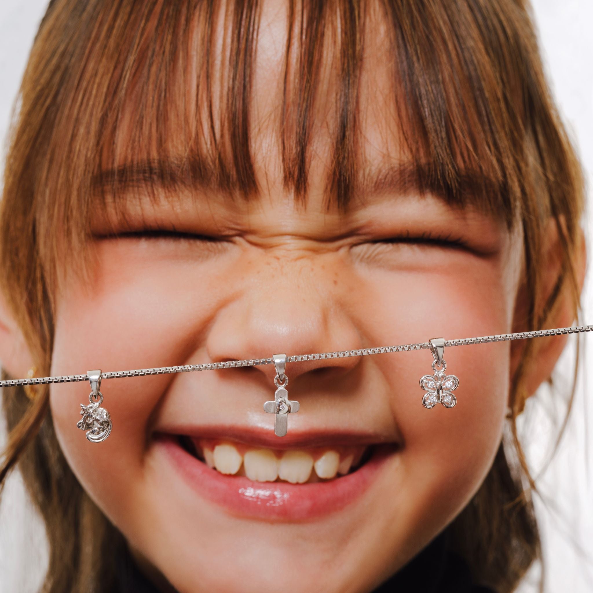 Blue Francis Tween Chain Sterling Silver, Box Chain 1mm made in Italy. This is a close-up picture of Blue Francis model, with a box chain featuring three Silver sterling pendants.