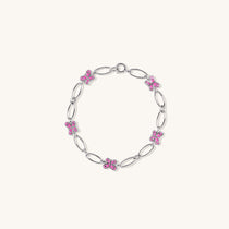 Brooklyn Butterfly Bracelet in sterling silver with pink enamel, shown flat on neutral background with bright lighting for detail.
