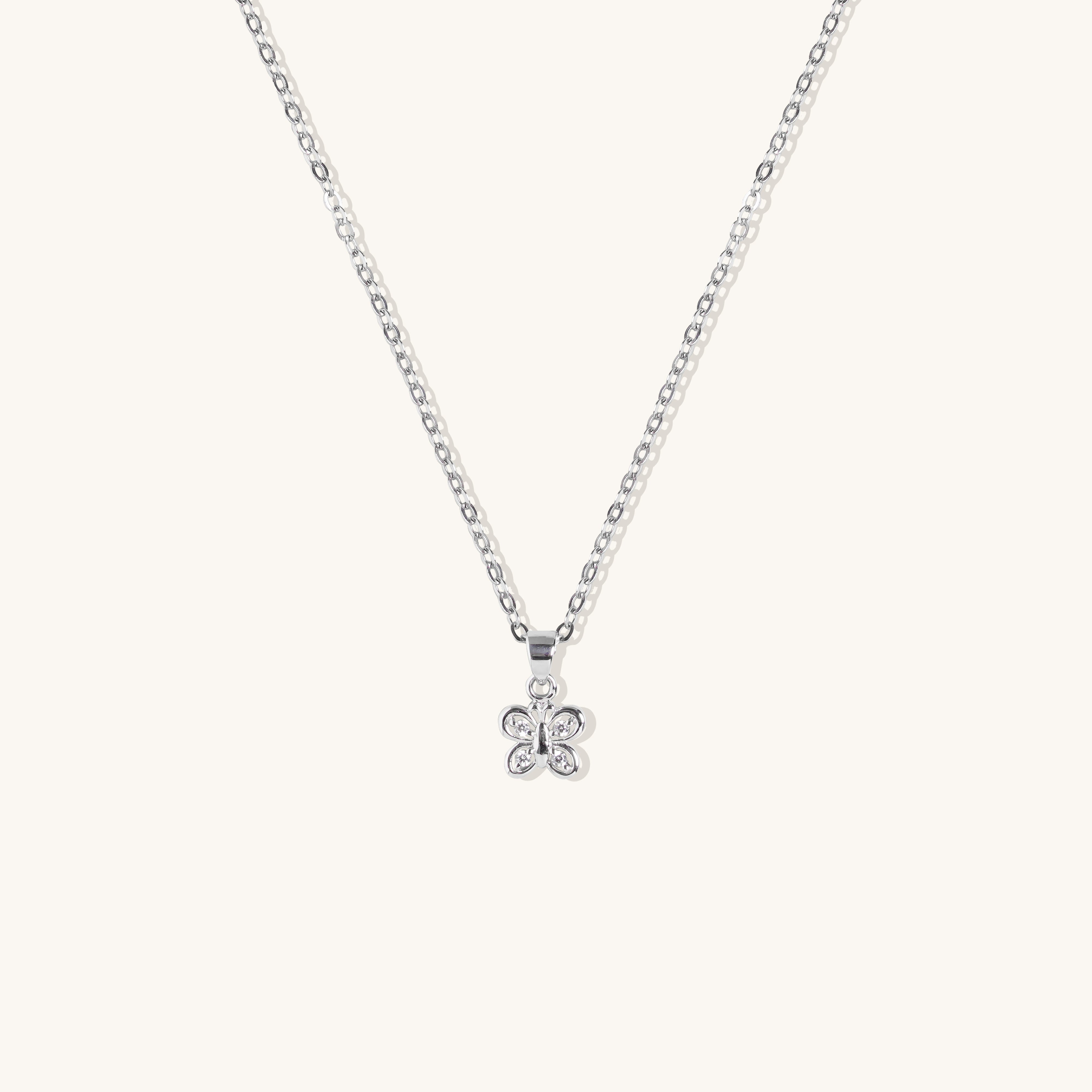 Brooklyn Butterfly Necklace in sterling silver with cubic zirconia stone, displayed on neutral background for clear product detail.
