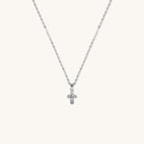 Brooklyn Cross Necklace in sterling silver with cubic zirconia and small heart center, displayed on neutral background for product clarity.