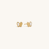 Delicate 14K Gold butterfly stud earrings for children featuring white enamel wing accents, perfect for kids' fine jewelry collection, hypoallergenic earrings for sensitive ears.