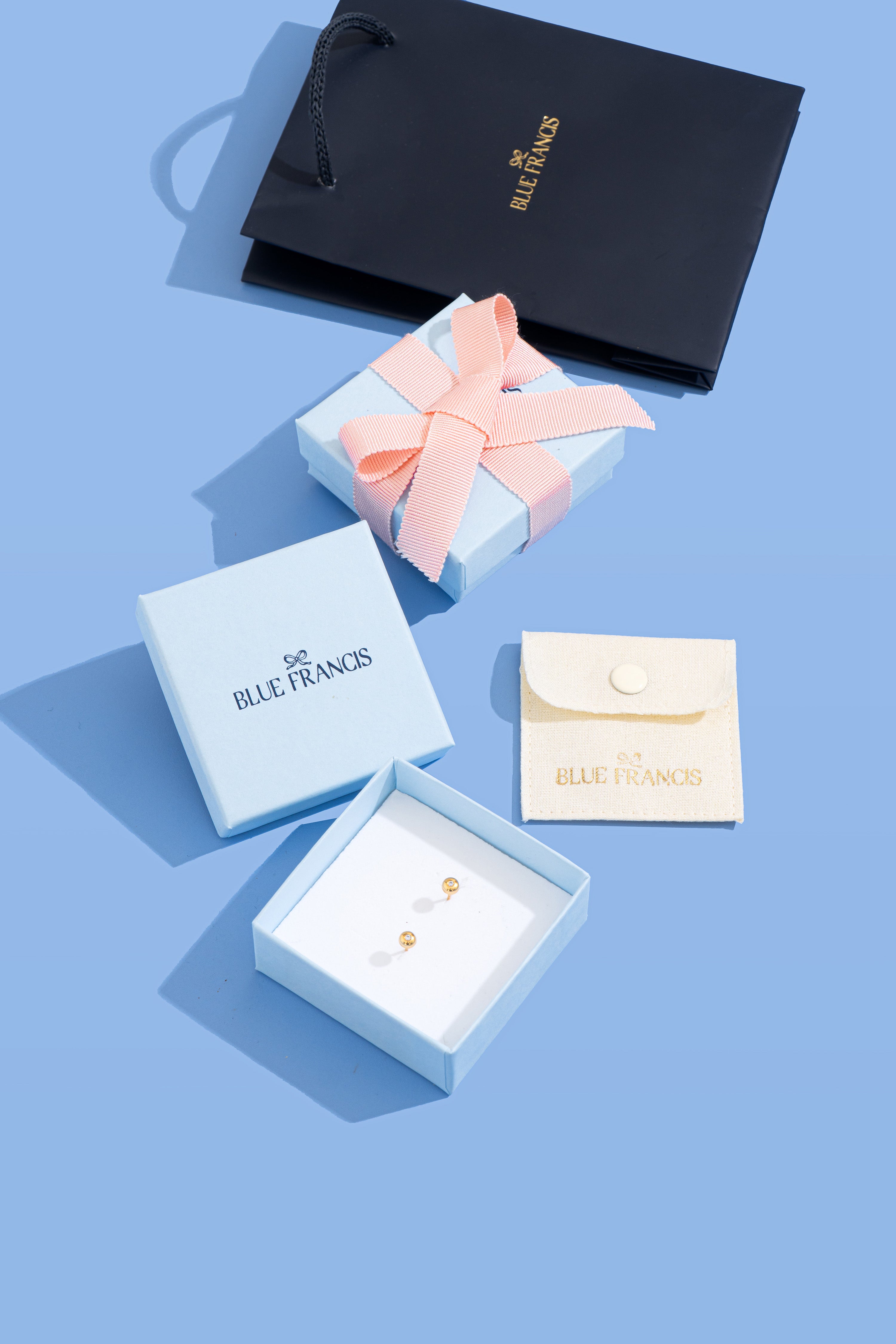 Sophisticated Blue Francis gift packaging with box and pouch for Brooklyn Cross Necklace in sterling silver.