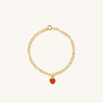 Red Central Heart Bracelet in vermeil with rolo chain and red enamel heart charm, shown from a side angle on neutral background for detail clarity.