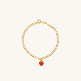 Red Central Heart Bracelet in vermeil with rolo chain and red enamel heart charm, shown from a side angle on neutral background for detail clarity.