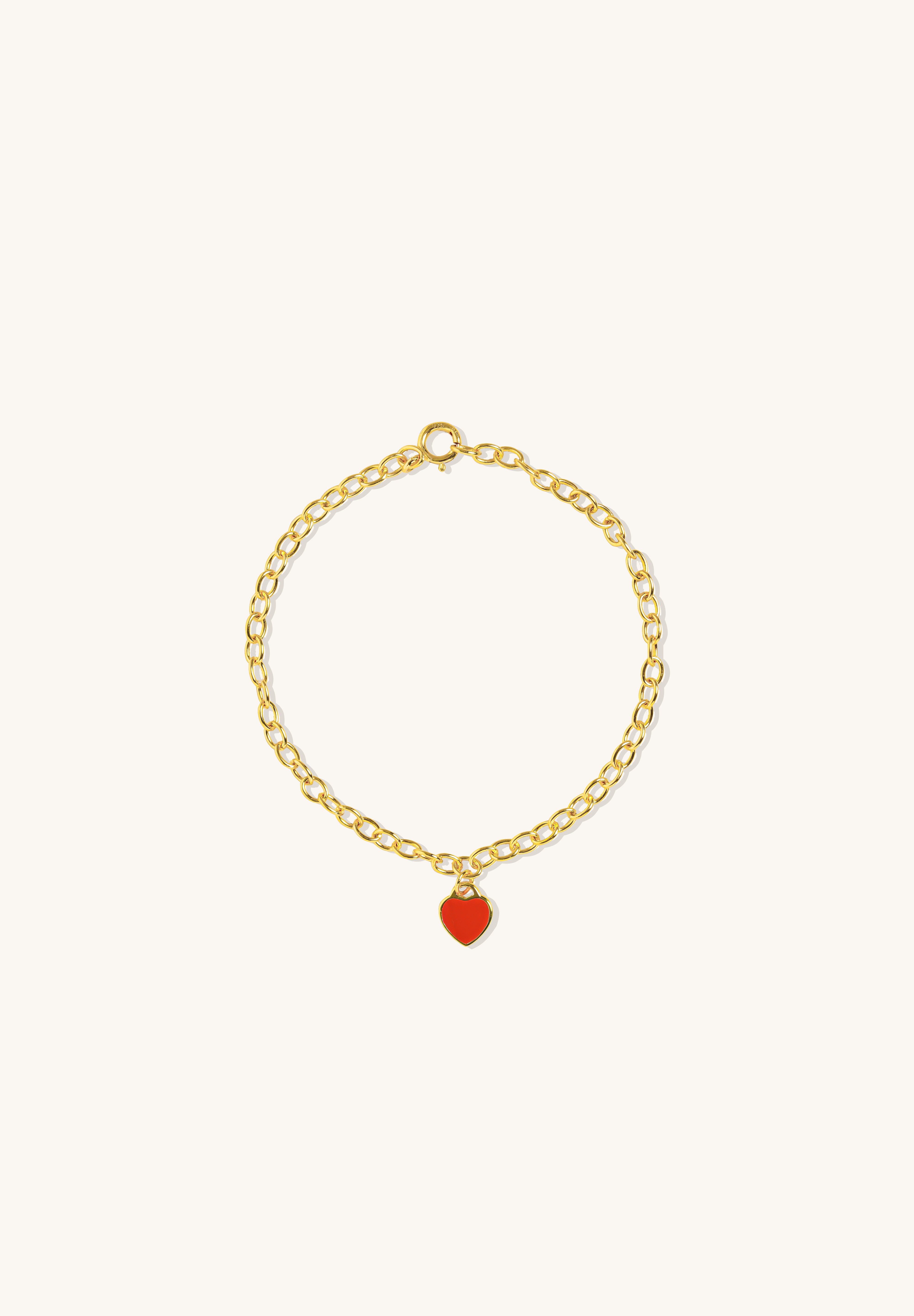 Red Central Heart Bracelet in vermeil with rolo chain and red enamel heart charm, shown from a side angle on neutral background for detail clarity.