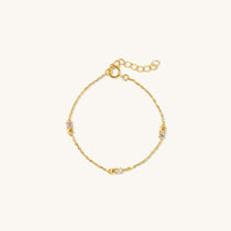 Twinkle Bracelet in vermeil with six cubic zirconia stones, displayed flat on neutral background for product detail, a cute bracelet style.