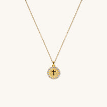 Gold vermeil kids cross pendant necklace with round medallion design and sparkling cubic zirconia halo, religious children’s jewelry gift for faith-inspired occasions.